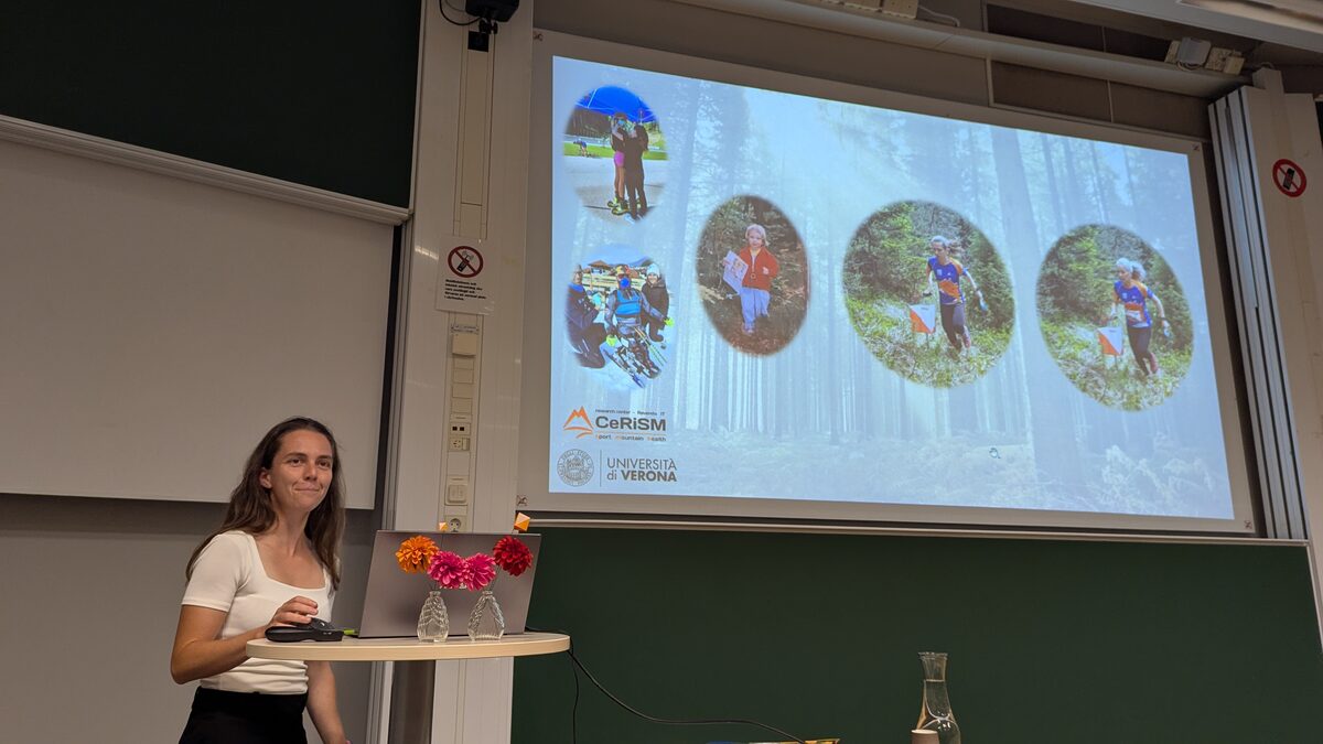 A speaker presenting research in the orienteering and well-being session