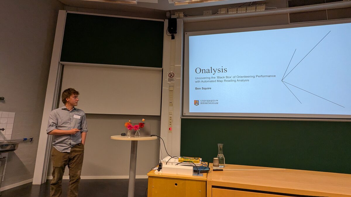 A speaker presenting the Onalysis orienteering analysis project